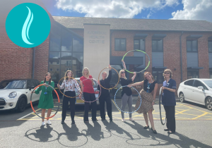 Staff Holding Hula Hoops
